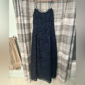 Navy with design. Prom dress size 11/12 . Never worn. Comes with dress cover.